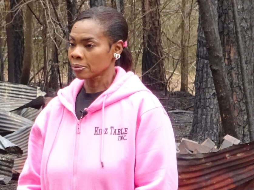 Owner of Somerville schoolhouse, Lynette Burton, in front of the damage.
